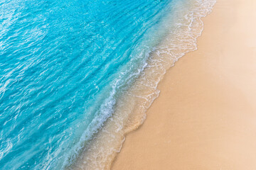 Closeup of waves sand beach and blue summer sea. Panoramic beach landscape. Mediterranean tropical...