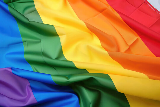 Vibrant rainbow pride flag with textured fabric folds. Generative AI image
