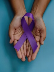 A person is holding a purple ribbon in their hands. The ribbon is purple and is being held up to show support for a cause