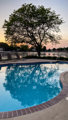 Outdoor Pool with Reflections at Sunset