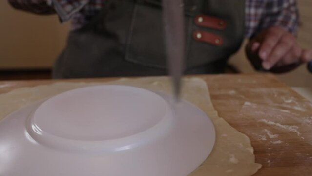 a male chef makes kutab dough in a home kitchen