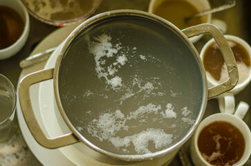 Metal sink full of dirty dishes, crockery, tableware. High quality photo