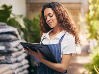 Woman, florist and writing on checklist in garden for stock, plants or sustainable growth at store....