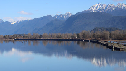Cascadia Mountains reflected in the waters of tranquil river