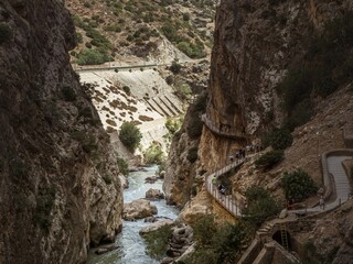 Tourists walking on the walkway at the gorge canyon of the El Caminito del Rey in Andalusia