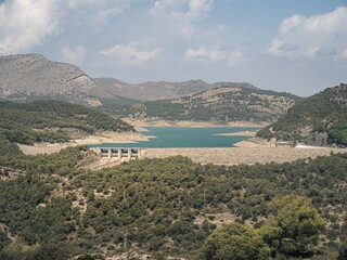 Obraz premium View of the dam of a hydroelectric power plant on the Guadalhorce - Guadalteba Reservoir in Southern Spain, Andalusia, near Malaga