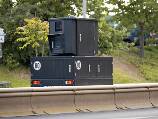 Speed camera on a trailer set up next to a big street. Technology to measure the speed of the car...