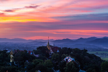 Gorgeous sunset over Thai Buddhist Pagoda. Beautiful Doi Saket temple view. Amazing North Thailand...