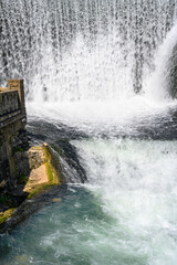 New Athos, Abkhazia, Georgia - July 04, 2022: The beautiful artificial waterfall and tourists on a...
