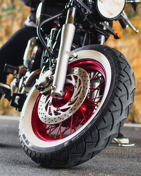 Person Riding Motorcycle on Urban Street
