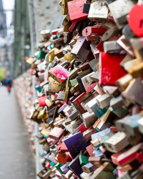 Wall Covered in Padlocks on Street