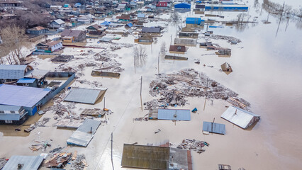 Fototapeta premium Global warming, floods on the planet.The apocalypse, catastrophes.Storms and destruction.Natural disasters,climate change,the riot of nature.The remnants of human life are floating in dirty water.End