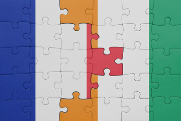 puzzle with the colourful national flag of cote divoire and flag of france.