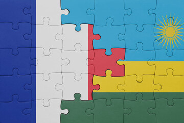 puzzle with the colourful national flag of rwanda and flag of france.