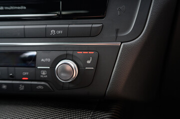 Car Heated Seats Functionality: Close-Up of Heated Seat Buttons in a Modern Vehicle
