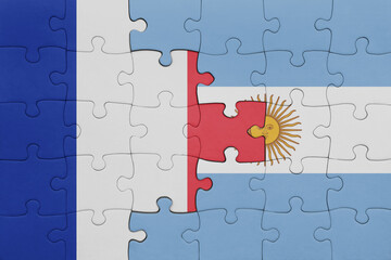 puzzle with the colourful national flag of argentina and flag of france.