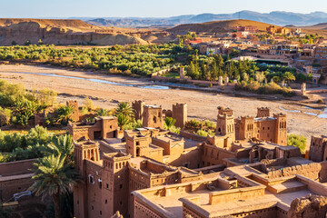 View of Ksar Ait Ben Haddou, old Berber ancient village or kasbah with desert in background, Ouarzazate, Morocco, North Africa