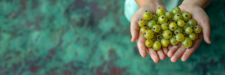 Little Hands Full of Gooseberries Against a Green Gradient Backdrop