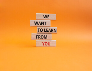 We want to learn from you symbol. Wooden blocks with words We want to learn from you. Beautiful orange background. Business and We want to learn from you. Copy space.