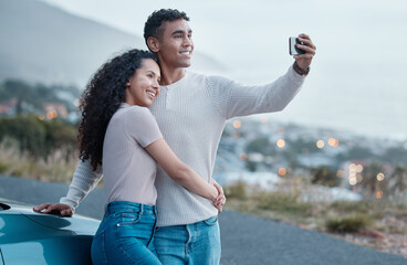 Couple, selfie and car on road trip, vacation and hug for profile picture on mobile app with smile...