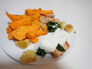 fresh vegetable salad with salmon and fries