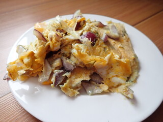 scrambled eggs with onion on a plate
