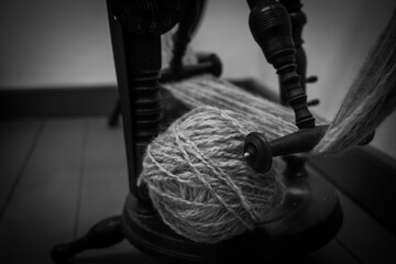 yarn threads on spinning-wheel