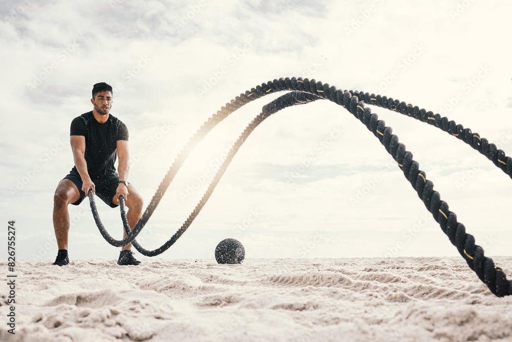 Wall mural Fitness, with battle rope on beach for endurance challenge, strength or core training in outdoor. Exercise, sports and male athlete for muscle development, intense performance or full body workout - Wall murals