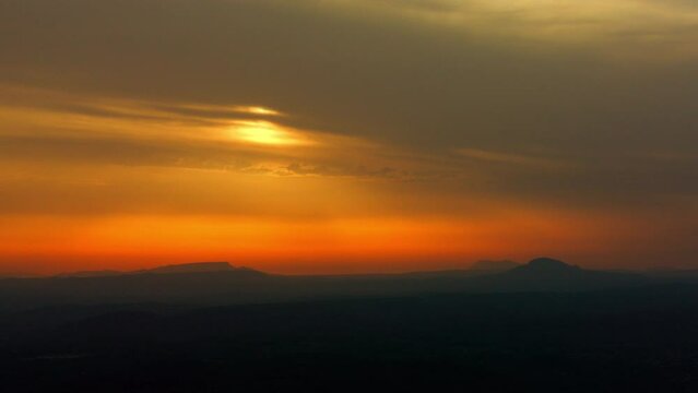 vue a&eacute;rienne drone de la montagne Sainte Victoire &agrave; cot&eacute; d'Aix en Provence en France en contre jour au couch&eacute; du soleil
