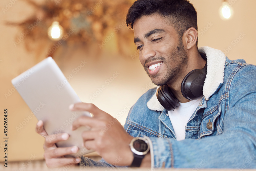 Poster man, headphones and happy in cafe with tablet, smile and relax online with social media streaming or