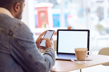 Man, back and smartphone or laptop mock up in coffee shop, screen and freelancer relax with mobile app. Browse, email and social media or online shopping, remote work and blank communication in cafe