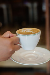 cup of coffee in hand