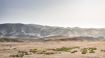 Panorama of mountains and hills in the mountains of Tajikistan, landscape for background on a sunny summer day
