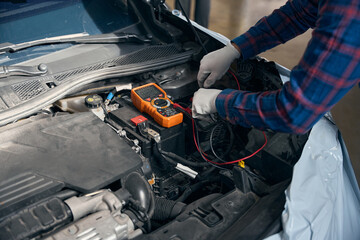 Professional worker checking transport in tire fitting