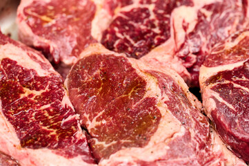Juicy Black Angus steaks marinated with spices. Close-up shot