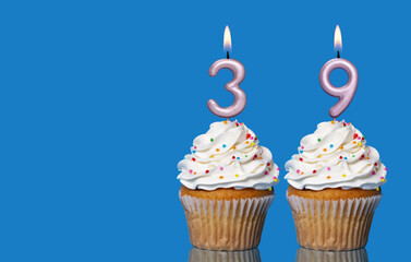 Birthday Cupcakes With Candles Lit Forming The Number 39