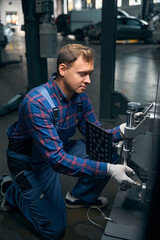 Employer working with instrument for wheel repair