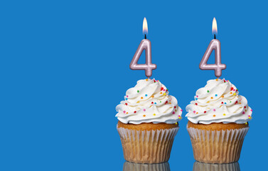 Birthday Cupcakes With Candles Lit Forming The Number 44