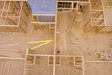 Building construction, is roof wall framed with wooden beams at time of construction of new home