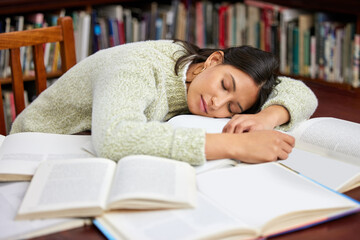 Student, sleeping woman and library book with study, exam and course research for project at school. University, tired and notes with learning, education and campus with fatigue for knowledge