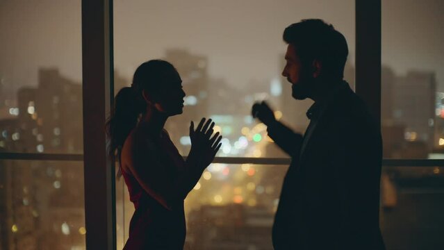 Married couple silhouettes quarrelling panoramic flat closeup. Sad woman crying