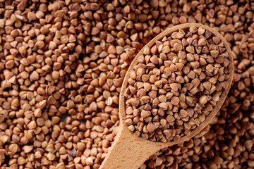 Scattered Dry Buckwheat with Wooden Spoon, Copy Space