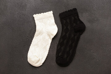 Basic color socks on black grunge background