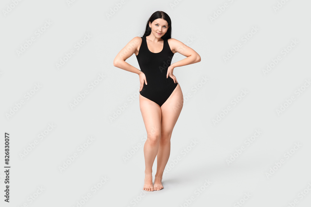 Canvas Prints Body positive young woman on light background