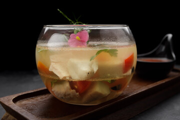 Jellied meat with quail eggs in a glass bowl