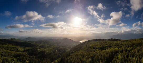 Dramatic Canadian Mountain Landscape Cloudy Sunset. Aerial Panorama Background.