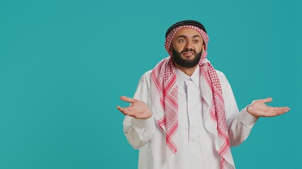 Muslim person being confused and unsure on camera, creating i dont know symbol and acting clueless...