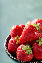 Fresh Ripe Strawberries in Decorative Bowl on Green Background, Copy Space