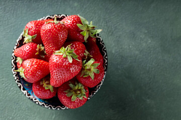 Fresh Ripe Strawberries in Decorative Bowl on Green Background, Copy Space