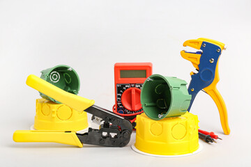 Set of electrician's tools on light background
